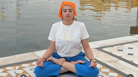 The woman, Archana Makwana, is a practitioner of yoga