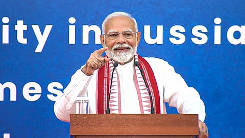 Prime Minister Narendra Modi addresses the Indian community in Russia during a programme, in Moscow.