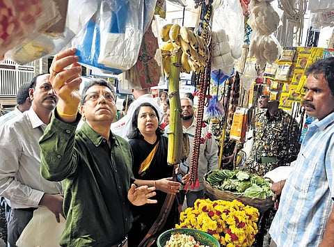 BBMP Chief Commissioner Tushar Girinath inspects plastic bags at a market in Hebbal, Bengaluru, on Wednesday