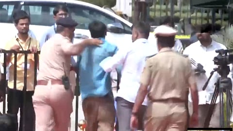 young man jumped on stage to wrap a shawl on CM Siddaramaiah