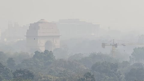 A view of India Gate covered with thin layer of smog, in New Delhi on Tuesday.