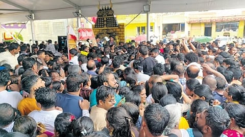 A large number of devotees jostle to get into the Hasanamba temple in Hassan on Thursday evening.