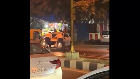 Two Delhi Police officers were dragged atop the bonnet of a car