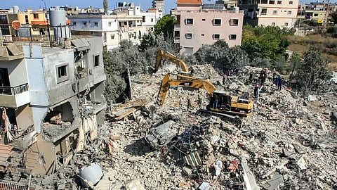 An excavator clears rubble and debris at the site of an overnight Israeli air strike on town of Sarafand, between Sidon and Tyre in southern Lebanon, on October 30, 2024.