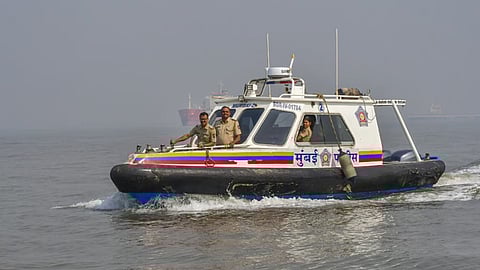 Security personnel during a search operation for missing passengers a day after a ferry-Navy craft collision claimed 13 lives off Mumbai.