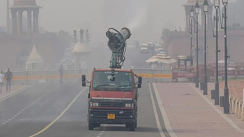 An anti-smog gun sprays mist to mitigate smoggy conditions