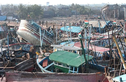 In this photo dated Dec. 30, 2004, damaged fishing trawlers lie in abandoned condition in a fishing jetty after the devastation