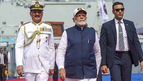 Prime Minister Narendra Modi with Chief of the Naval Staff Admiral Dinesh K. Tripathi during the commissioning ceremony of three Indian Navy warships.