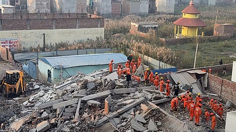 Rescue work underway after a four-storey building collapsed