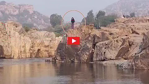 Doctor jumps into river