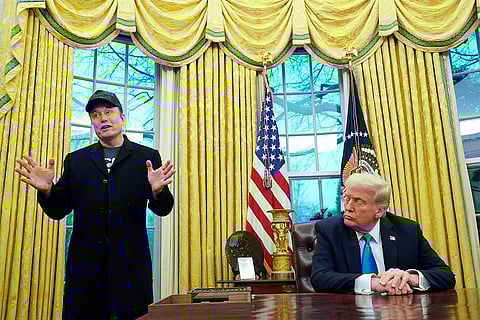 President Donald Trump listens as Elon Musk speaks in the Oval Office at the White House, Tuesday, Feb. 11, 2025, in Washington.