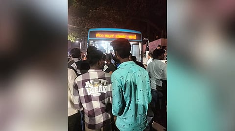 People gather around the BMTC bus involved in the accident on Old Airport Road on Wednesday.