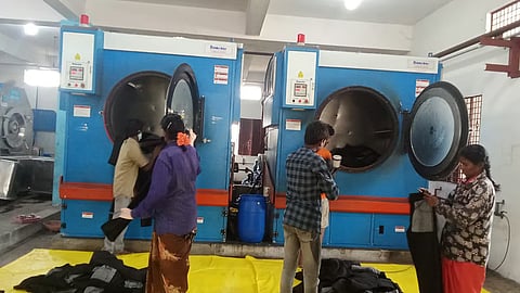 Workers washing jeans products at a washing unit in Ballari