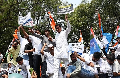 Congress workers and leaders shouting slogans during their protest against the Enforcement Directorate filing charges against former Congress president Sonia Gandhi and Leader of Opposition in Lok Sabha Rahul Gandhi at AICC in New Delhi.