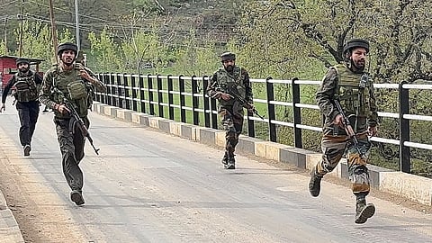 Security personnel rush to the spot after terrorists attacked a group of tourists at Pahalgam, in Anantnag district, Jammu & Kashmir