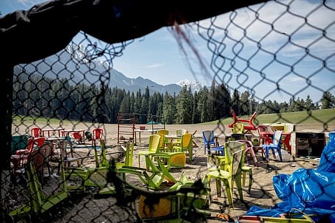 Chairs and tables are scattered at the site of where terrorists killed several innocent tourists in Baisaran, Pahalgam.
