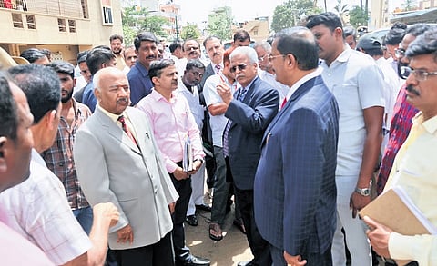 Lokayukta Justice BS Patil and Upa Lokayuktas justices KN Phaneendra and B Veerappa inspect flood-affected areas of the city on Thursday.