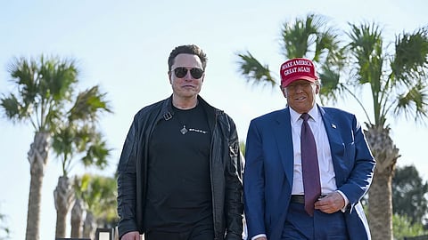President-elect Donald Trump walks with Elon Musk
