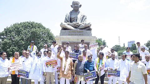Members of the BJP staged a protest in front of the Mahatma Gandhi statue on the Vidhana Soudha premises.