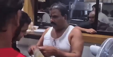 Shiv Sena MLA Sanjay Gaikwad , scolding the manager, forcing him to smell stale dal and rice.