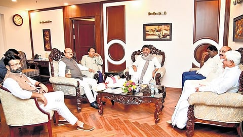 Deputy Chief Minister DK Shivakumar, who is also state Congress president, interacts with Congress legislators from Karnataka, in New Delhi on Wednesday