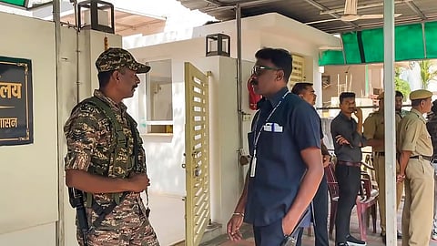Security personnel stand guard during raids by the Enforcement Directorate (ED) on premises linked to Chaitanya Baghel.