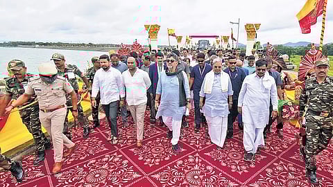CM Siddaramaiah and DCM DK Shivakumar arrive to offer bagina at the Kabini reservoir in HD Kote taluk, Mysuru district, on Sunday.