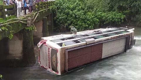 Private Bus falls into stream