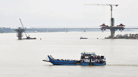 A view of ferry carrying passengers across the river Brahmaputra