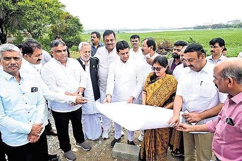 The committee, headed by Shivajinagar MLA Rizwan Arshad (centre, holding chart), inspects lakes in Bengaluru East taluk on Wednesday