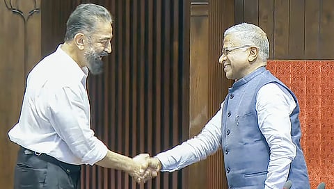 Harivansh Narayan Singh being greeted by Makkal Needhi Maiam (MNM) leader Kamal Haasan.