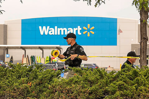 Grand Traverse Sheriff's deputies tape off the parking lot of a Walmart after a stabbing incident in Traverse City, Mich., Saturday July 26, 2025.