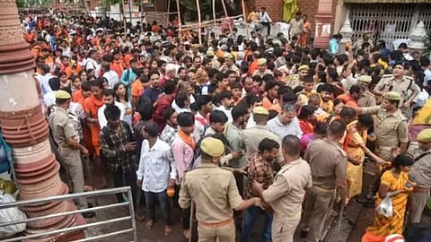 The electric current spread through the tin shed as the wire fell, triggering panic and a stampede in the temple premises.