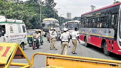 Traffic being diverted by policemen on Anand Rao Circle flyover due to Congress’ protest at Freedom Park on Friday,