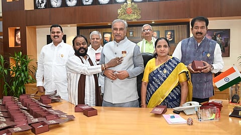 TA Saravana distributed gold-plated silver Gandaberunda emblem to Basavaraj Horatti.
