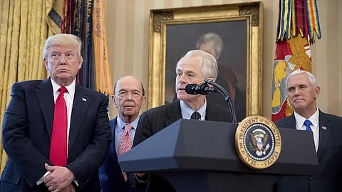 National Trade Council adviser Peter Navarro, second from right, accompanied by President Donald Trump