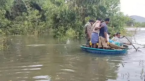 A body being ferried to the islet on a coracle in the Bhadra backwaters