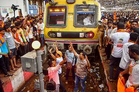 Maratha community members stop a train during their protest seeking reservation for the community under the OBC category,