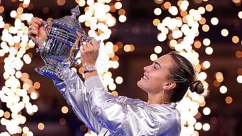 Aryna Sabalenka, of Belarus, holds her trophy aftyer defeating Amanda Anisimova, of the United States, after the women's finals of the U.S. Open tennis championships