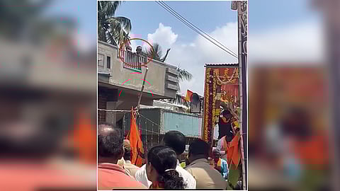 Boys spit on Ganesh immersion procession