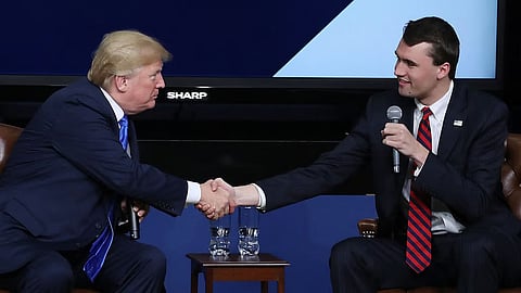 US President Donald Trump shakes hands with conservative activist Charlie Kirk at a forum dubbed the Generation Next Summit at the White House (File photo)