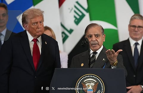Flanked by President Donald Trump, Pakistan Prime Minister Shehbaz Sharif speaks during the Gaza International Peace Summit in Sharm el-Sheikh