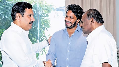 BJP state president BY Vijayendra greets Union minister HD Kumaraswamy and his son and JDS Youth Wing president Nikhil Kumaraswamy in Bengaluru on Tuesday