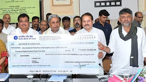 dividend check recived by CM Siddaramaiah