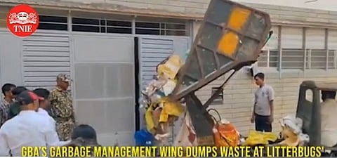 Garbage dumped in front of houses