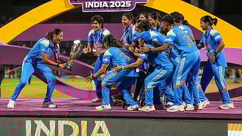 Indian cricket team celebrates with Women's ODI World Cup trophy.