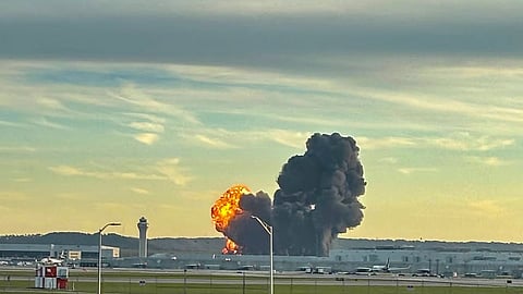 This handout photo courtesy of Levi Dean shows smoke and flames rising from the site of a UPS cargo plane crash