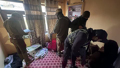 Security personnel during a crackdown against the banned organisation Jamaat-e-Islami (JeI), in Kulgam, Jammu and Kashmir.