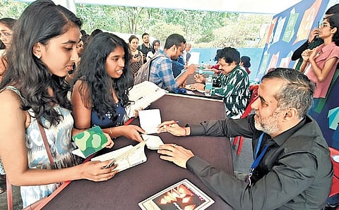 Writer Chetan Bhagat interacts with his fans at Bengaluru Literature Festival, at Freedom Park, on Sunday