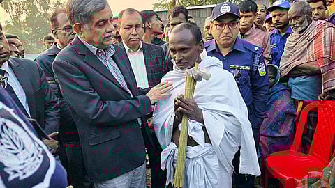 Bangladesh Education Adviser C.R. Abrar meets Rabilal Das, father of Dipu Chanrda Das, and expresses his condolences in Mymensingh